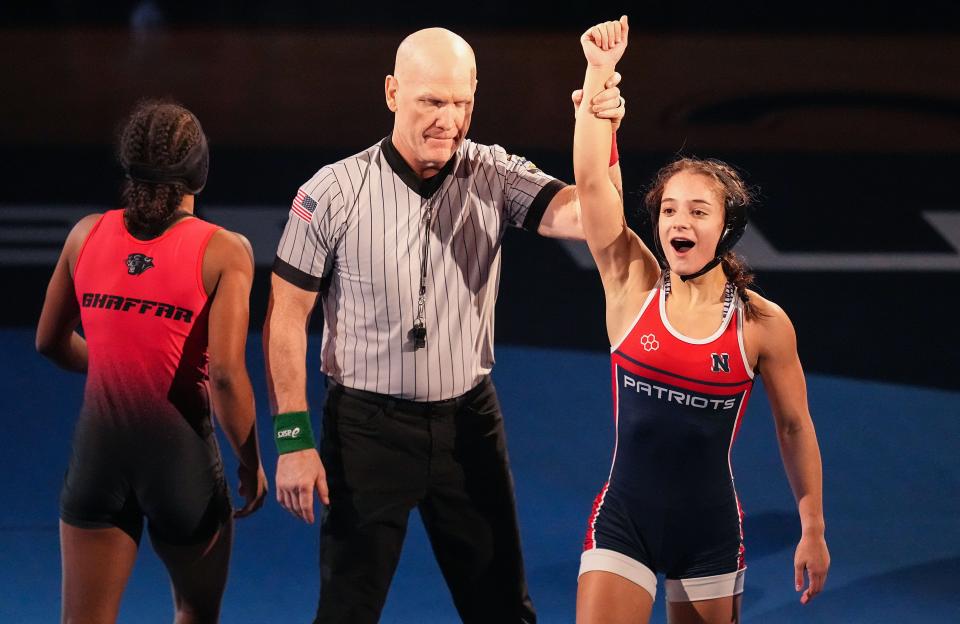 Terre Haute North's Sophia Buechner defeats NorthWood's Naima Ghaffar in the 120-pound bout Friday, Jan. 12, 2023, during the Indiana High School Girls Wrestling state finals at Memorial Gymnasium in Kokomo.