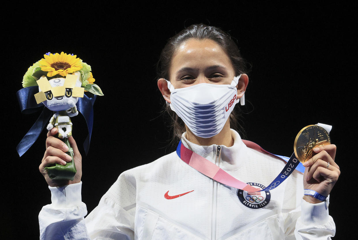 Gold medallist Lee Kiefer of the United States poses at a victory ceremony for the women's foil fencing (Sergei Bobylev / TASS / Getty Images)