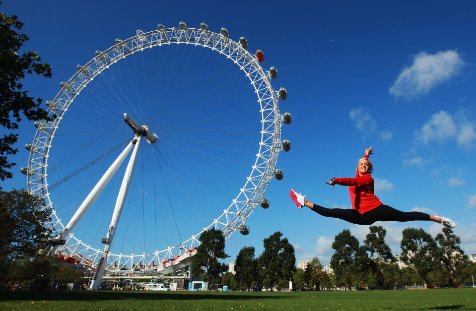 LONDON, ENGLAND - SEPTEMBER 13: Gymnast Nastia Liukin of the USA poses by the London Eye during a tour of London on September 13, 2011 in London, England. (Photo by Bryn Lennon/Getty Images for USOC)