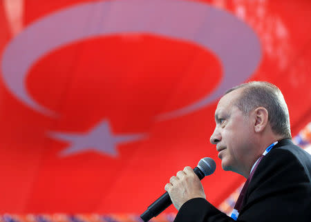 Turkish President Tayyip Erdogan speaks during a meeting of his ruling AK Party in Giresun, Turkey March 25, 2018. Murat Cetinmuhurdar/Presidential Palace/Handout via REUTERS