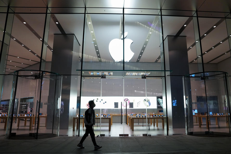 BEIJING, CHINA - MARCH 31: A Chinese man wears a protective walk through the apple store on March 31, 2020 in Beijing, China. The Coronavirus (COVID-19) pandemic has spread to at least 185 countries, claiming over 3,8000 lives and infecting hundreds of thousands more. (Photo by Lintao Zhang/Getty Images)