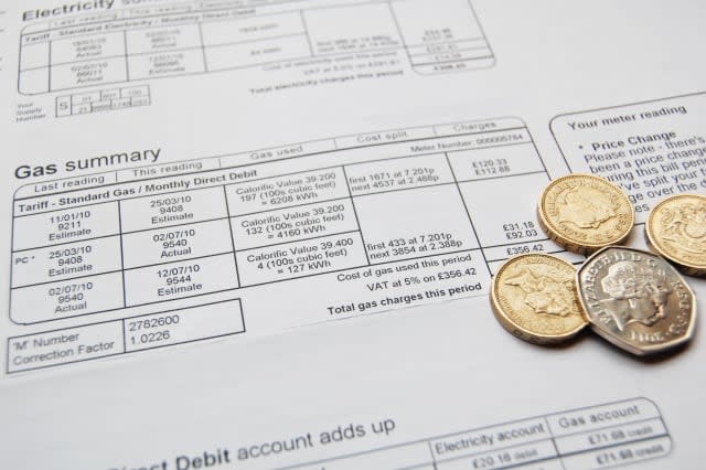 utility bill and coins for...