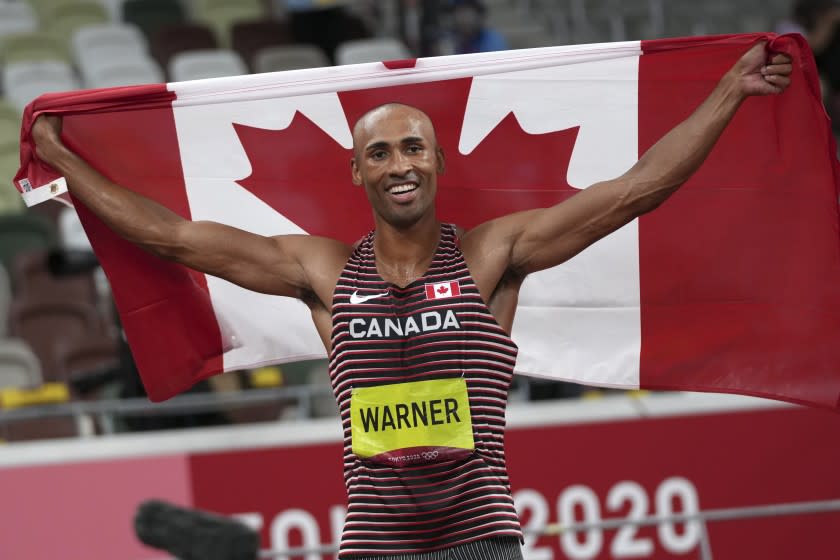 Damian Warner, of Canada reacts after he won the gold medal for the decathlon at the 2020 Summer Olympics, Thursday, Aug. 5, 2021, in Tokyo. (AP Photo/Matthias Schrader)