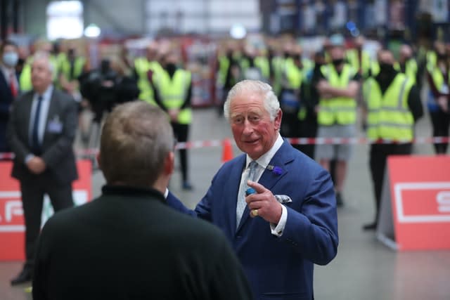 The prince shares a joke with foodservice driver Stephen Taggart during a visit to the Henderson Group’s food and grocery distribution centre. Niall Carson/PA Wire