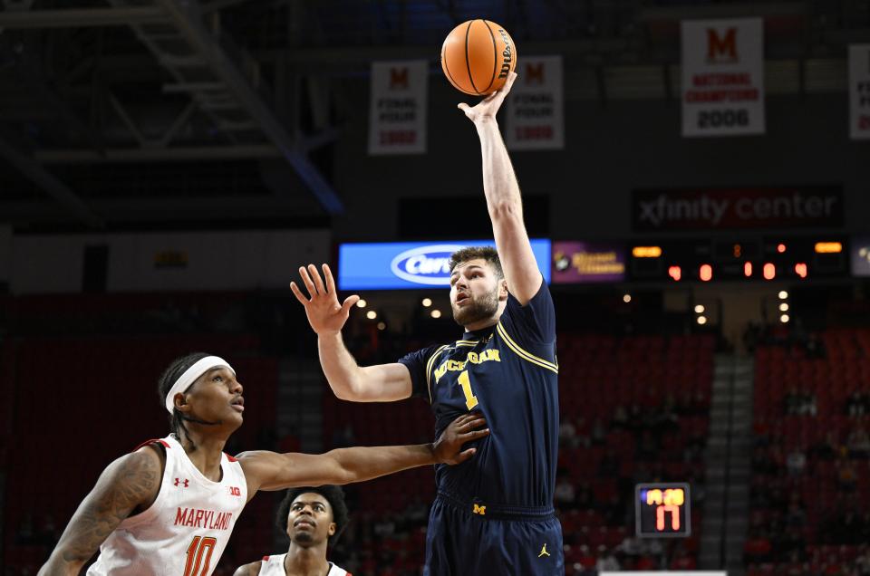 Hunter Dickinson (1) of the Michigan Wolverines shoots the ball in the first half against Julian Reese (10) of the Maryland Terrapins at Xfinity Center on January 19, 2023 in College Park, Maryland.