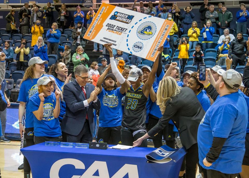 Jasmine Dickey shows off Delaware's NCAA Tournament ticket after win over Drexel for CAA title Sunday.