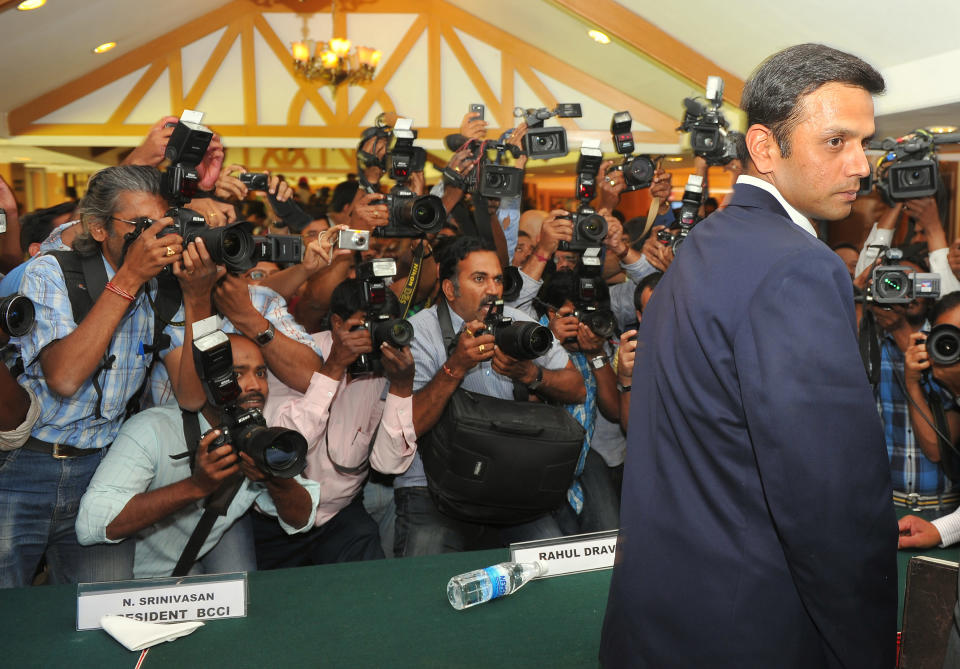 Indian cricketer Rahul Dravid is mobbed by the media after a press conference held at the Karnataka State Cricket Association (KSCA) to announce his retirement from Test cricket in Bangalore on March 9, 2012.