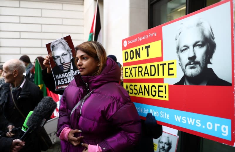 Supporters of WikiLeaks' founder Julian Assange gather outside Westminster Magistrates Court in London