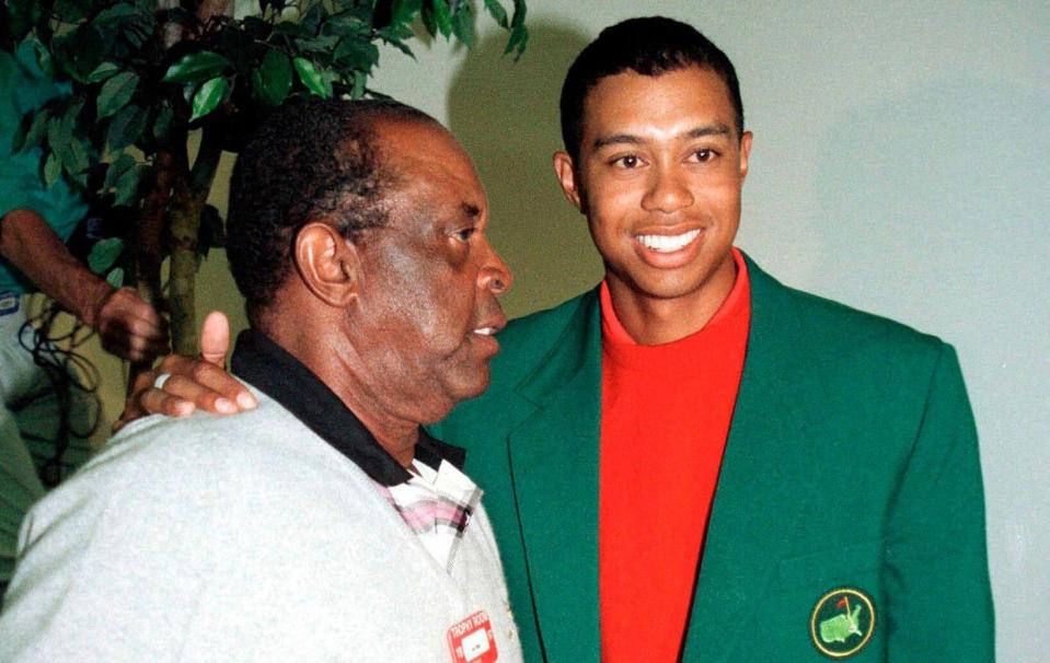Elder alongside Tiger Woods at the 1997 Masters - REUTERS