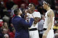 A team trainer attends to Rutgers guard Montez Mathis (23) after he was thrwon to the court by a Purdue defender during the first half of an NCAA college basketball game, Tuesday, Jan. 28, 2020, in Piscataway, N.J. The Purdue player was charged with a flagrant foul in the incident. (AP Photo/Kathy Willens)