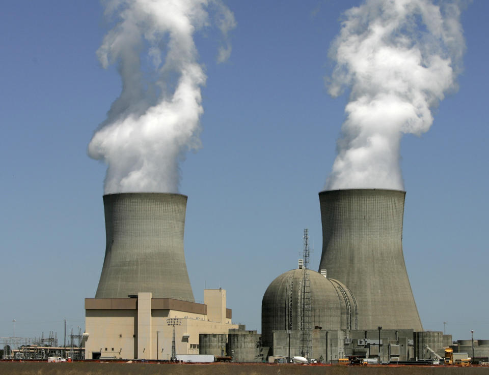 FILE - Steam rises from the cooling towers of the two original nuclear reactors at Plant Vogtle on April 28, 2010, in Waynesboro, Ga. Units 1 and 2 were originally estimated to cost $660 million, but cost $8.9 billion by the time they were completed in 1989, mirroring overruns in the later Units 3 and 4. (AP Photo/Mary Ann Chastain, File)