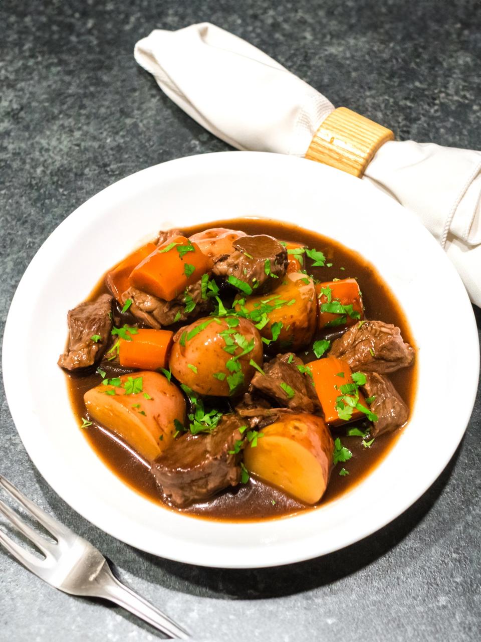 Slow cooker Irish Beef Stew has a rich Guinness gravy that's perfect for a cozy night or a St. Patrick's Day celebration.