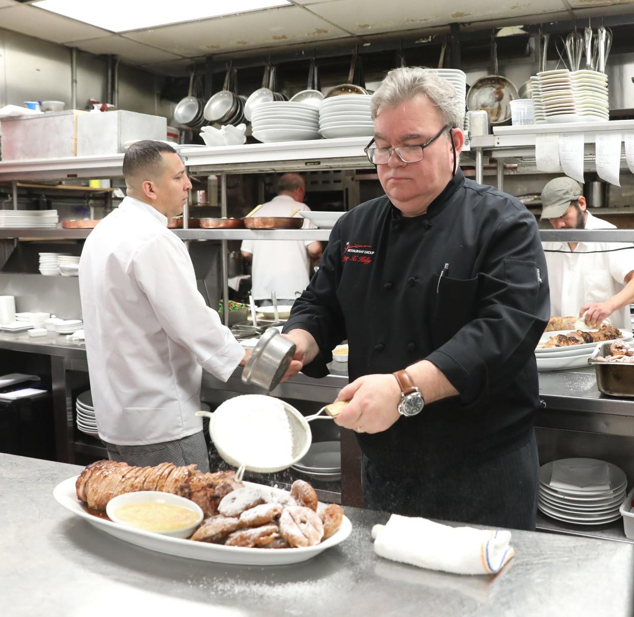 Chef Peter Kelly preparing Roasted Pork with Apple Sauce and Apple Fritters for Sunday brunch at Restaurant X in Congers in January 2019. The restaurant's Sunday multi-course brunch was legendary.