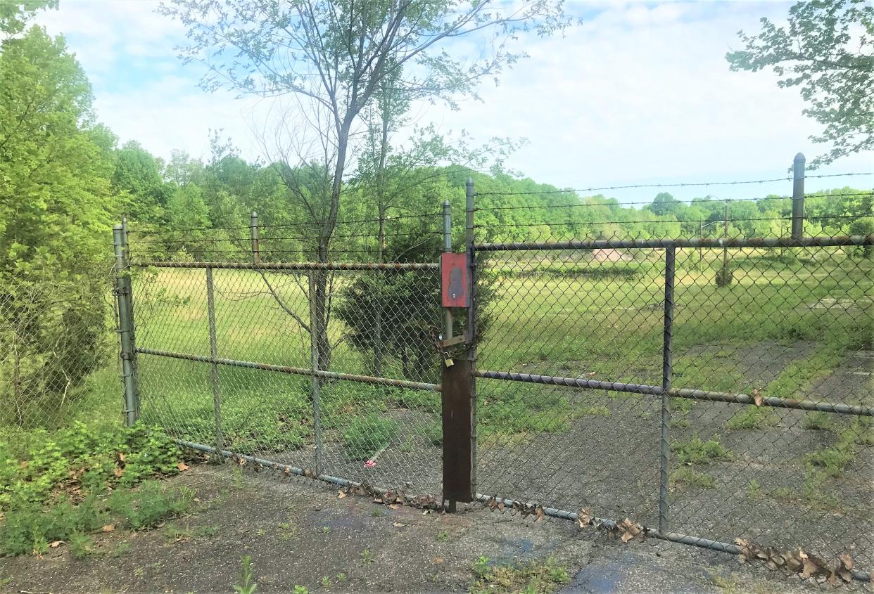 This padlocked gate at 523 Chestnut Avenue was the entrance to a long-demolished door fabrication business and warehouse in Woodbury Heights. Its next use is to be a large apartment complex, thanks to a state court case. PHOTO: May 7, 2024.