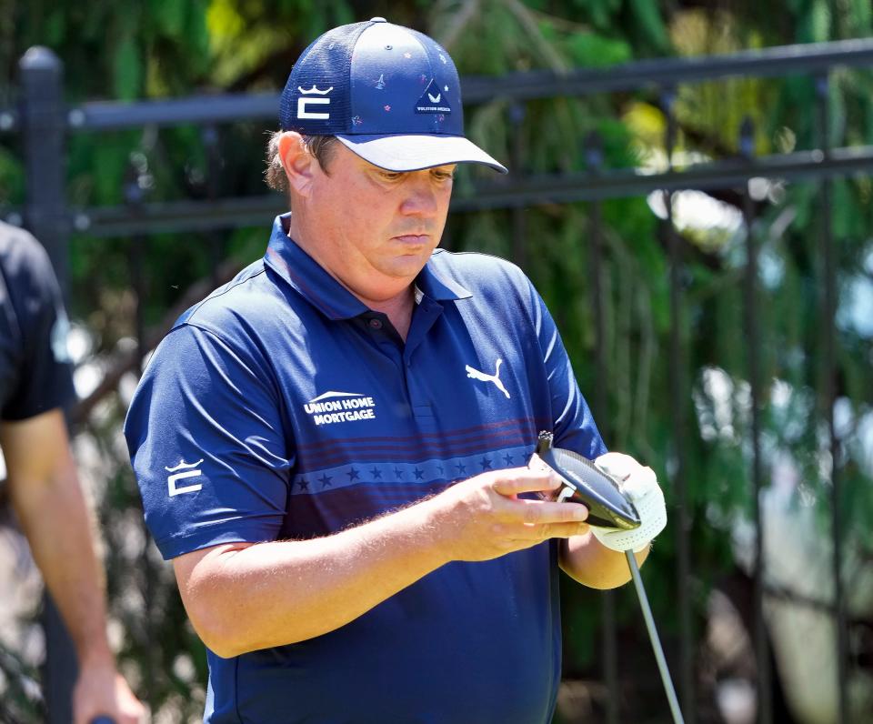 June 1, 2023: Dublin, Ohio, USA; Jason Dufner looks down at this driver head after breaking it on his tee shot on the 17th hole during opening round of the Memorial Tournament at Muirfield Village Golf Club.