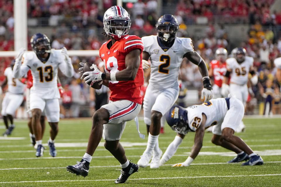 Ohio State receiver Marvin Harrison Jr. catches a pass against Toledo.