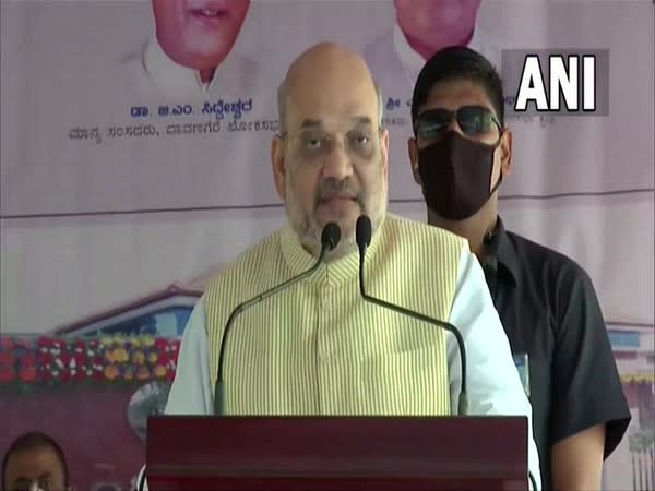 Union Home Minister Amit Shah addressing at the inaugurated of development projects in Karnataka's Davanagere on Thursday. [Photo/ANI]