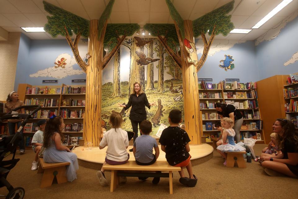 Author Debra Young Hatch talks to a group of children and their parents at the "Giraffes in My Closet" book reading at Barnes & Noble Friday, June 21, 2024.