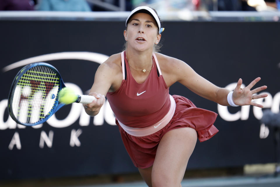 Belinda Bencic, of Switzerland, returns a shot to Ons Jabeur, of Tunisia, during the finals at the Charleston Open tennis tournament in Charleston, S.C., Sunday, April 10, 2022. (AP Photo/Mic Smith)