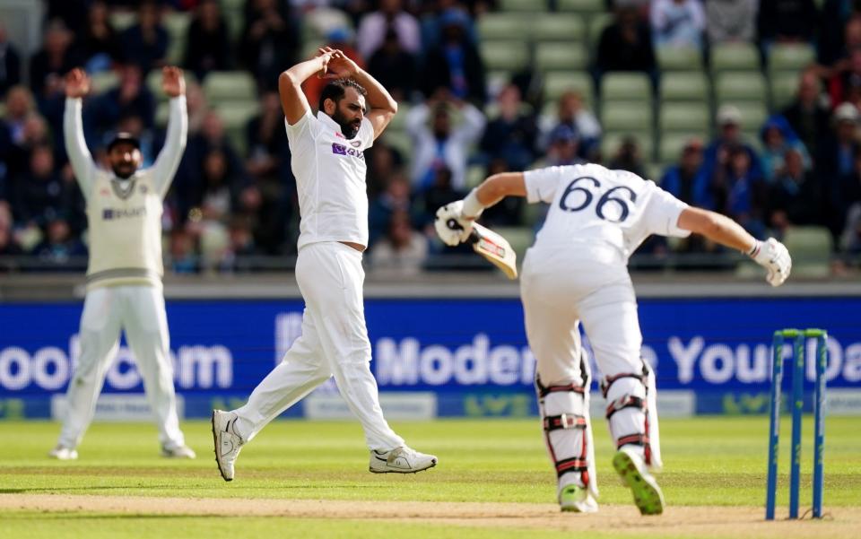 Mohammed Shami reacts after nearly dismissing Joe Root  -  PA