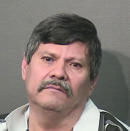 This booking photo provided by the Houston Police Department on Wednesday, April 23, 2014, shows Guillermo Correa. Police say, Correa, 56, a resident of a Houston nursing home will face capital murder charges for using the armrest of his wheelchair to beat two of his roommates to death. (AP Photo/Houston Police Department)