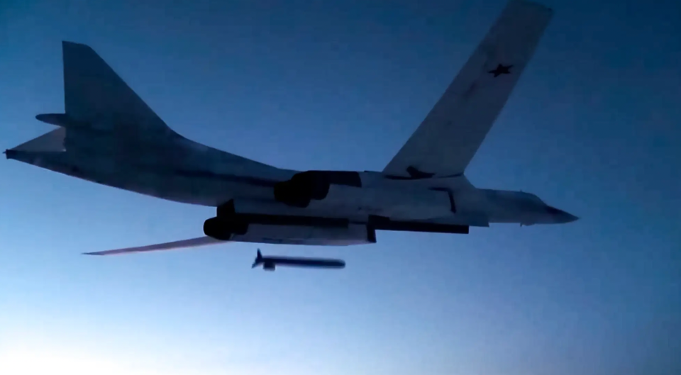 A Tu-160 launches a Kh-555 conventionally armed cruise missile at a test target during an exercise. <em>Russian Defense Ministry Press Service via AP</em>