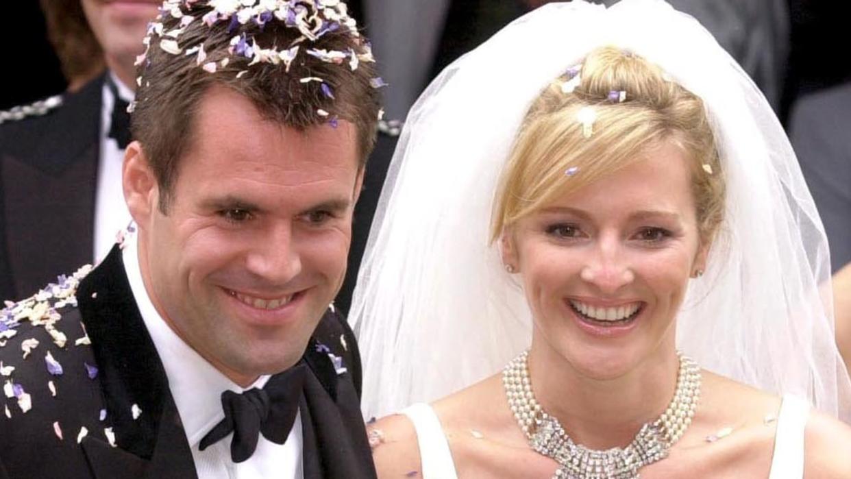 Gabby Logan and her husband covered in confetti on their wedding day