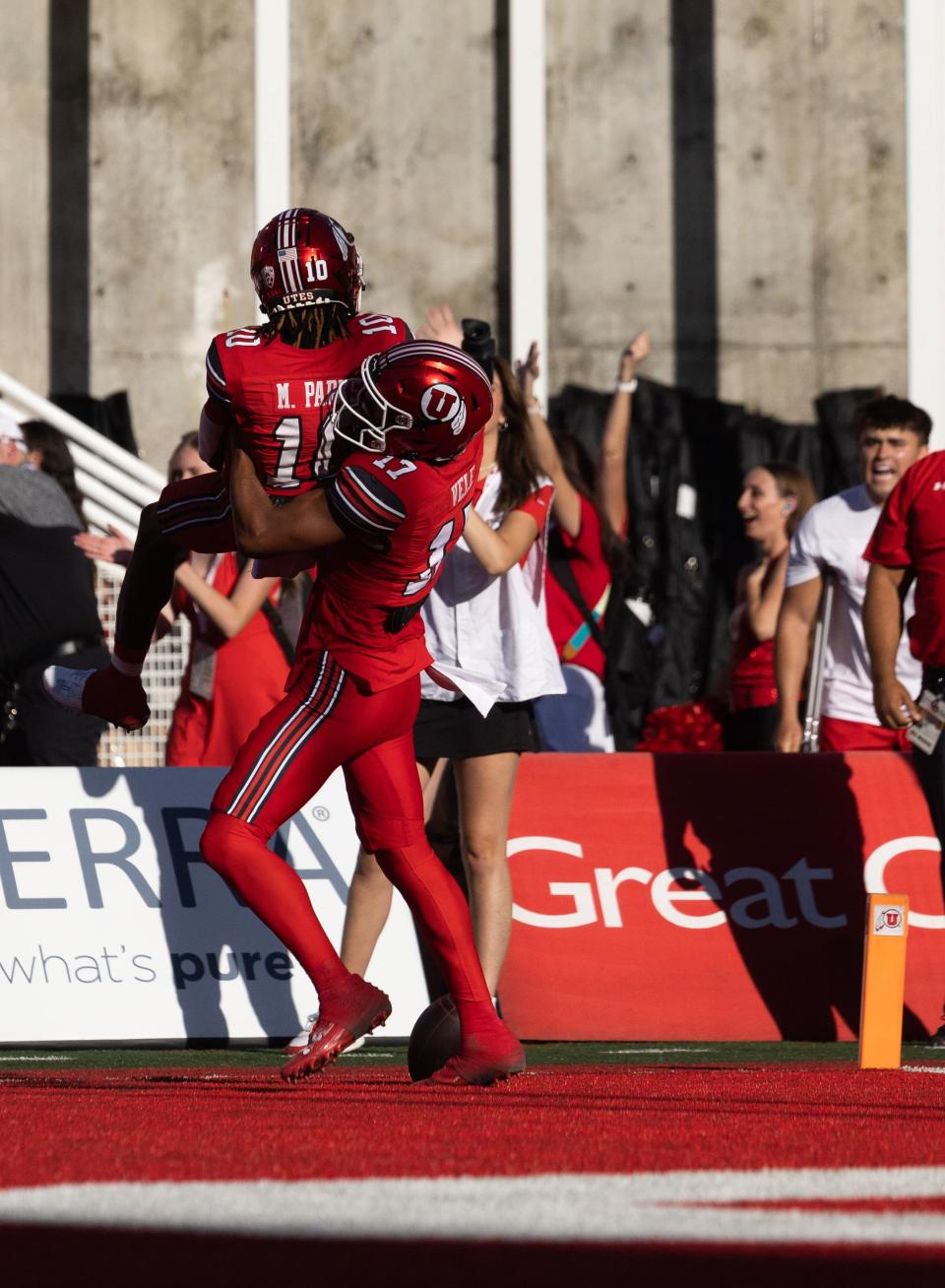 Utah Utes wide receiver Devaughn Vele (17) picks up Utah Utes wide receiver Money Parks (10) after Parks’ touchdown during the first quarter of their season opener against Florida at Rice-Eccles Stadium in Salt Lake City on Thursday, Aug. 31, 2023. | Megan Nielsen, Deseret News