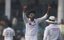 India's Axar Patel gestures to a teammate during the day three of their first test cricket match with New Zealand in Kanpur, India, Saturday, Nov. 27, 2021. (AP Photo/Altaf Qadri)