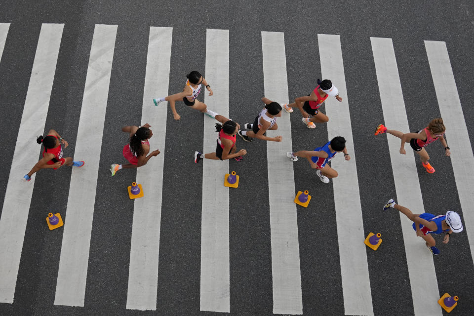 Runners compete in the women's marathon at the 19th Asian Games in Hangzhou, China, Thursday, Oct. 5, 2023. (AP Photo/Aijaz Rahi)