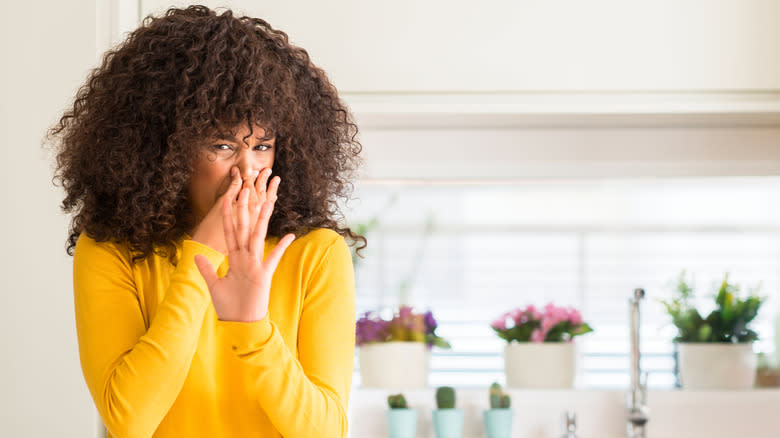 woman wearing yellow in kitchen