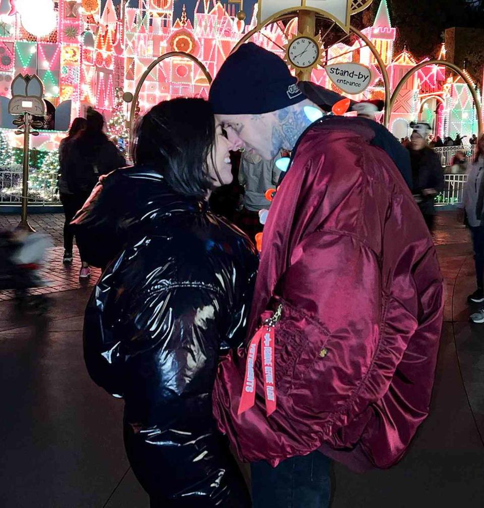 <p>The <em>Keeping Up with the Kardashians</em> alum and her rocker fiancé took their blended family to Disneyland to enjoy the holiday festivities — and even a little rain couldn't stop their fun!</p> <p>"The happiest place on earth, in the rain at Christmas time," wrote Kardashian, <a href="https://www.instagram.com/p/CXpd5eZLEjJ/" rel="nofollow noopener" target="_blank" data-ylk="slk:sharing photos;elm:context_link;itc:0;sec:content-canvas" class="link ">sharing photos</a> of the group taking in a fireworks show, enjoying the lights and decor and noshing on some candy cane-encrusted churros.</p>