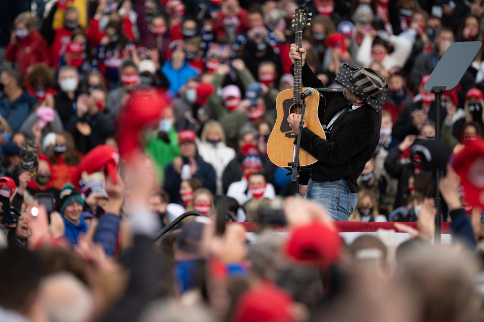 A singer performs the national anthem during a Make America Great Again campaign rally at the Erie International Airport on Wednesday, Oct. 21, 2020 in Erie, PA., United States. (Photo by Noah Riffe/Anadolu Agency via Getty Images)