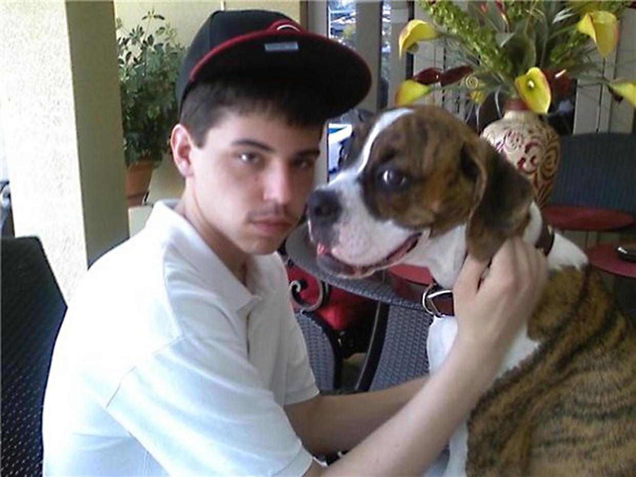 Preston Morehouse, shown here with his dog, was shot and killed at a home in Hebron on Jan. 17, 2010.