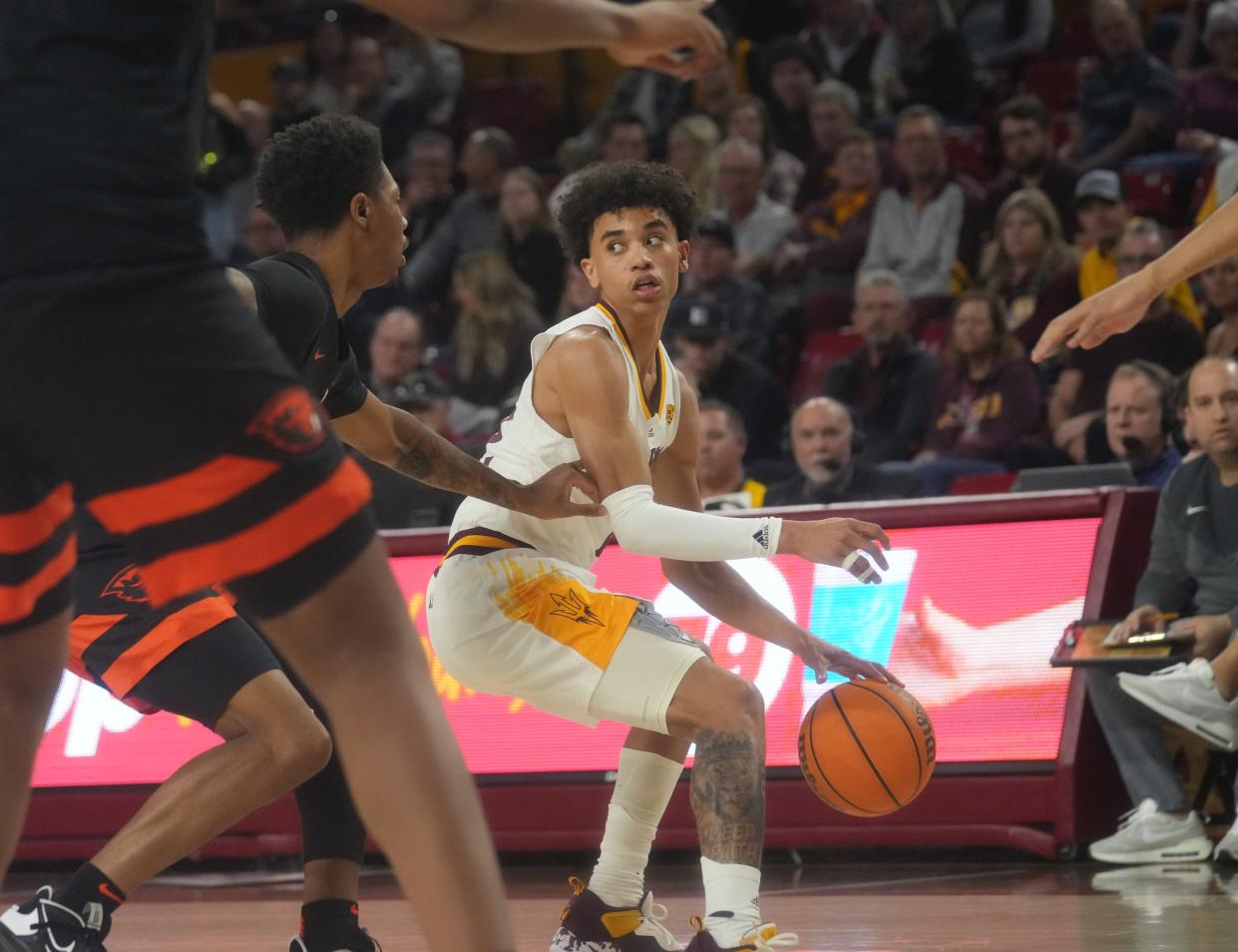 Arizona State Sun Devils guard Austin Nunez dribbles into the defense of the Oregon State Beavers at Desert Financial Arena in Tempe on Feb. 2, 2023.