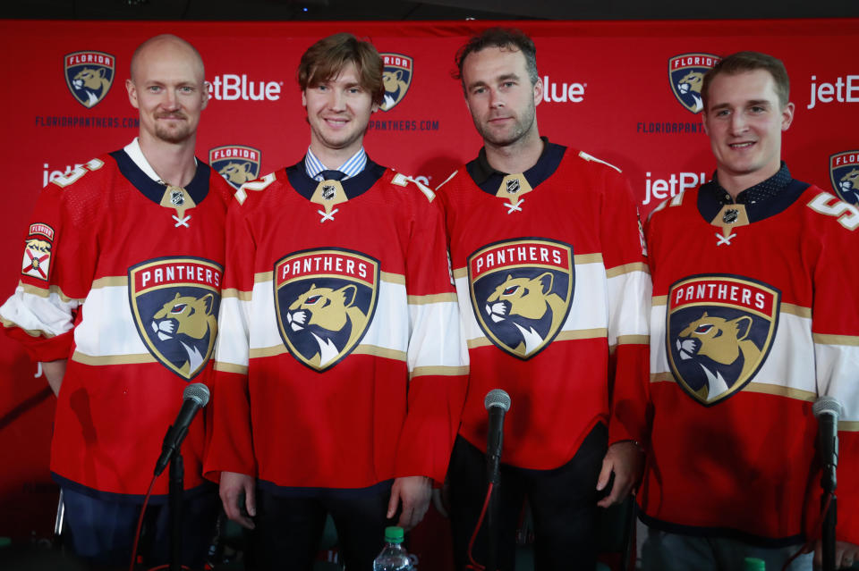The Florida Panthers newest players, from left, Anton Stralman, Sergei Bobrovsky, Brett Connolly and Noel Acciari pose for a photo after being introduced during an NHL hockey news conference, Tuesday, July 2, 2019 in Sunrise, Fla. The Panthers, New York Rangers and Nashville Predators were winners on Day 1 of NHL free agency. (AP Photo/Wilfredo Lee)