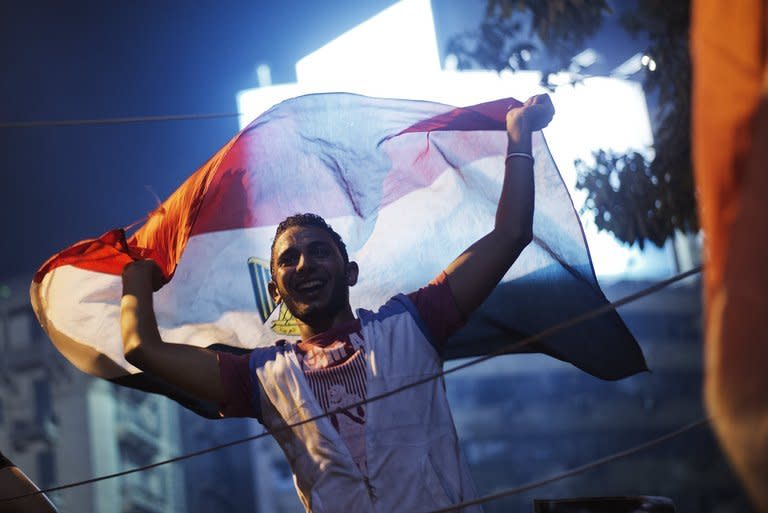 People celebrate at Cairo's Tahrir Square in Egypt on July 3, 2013