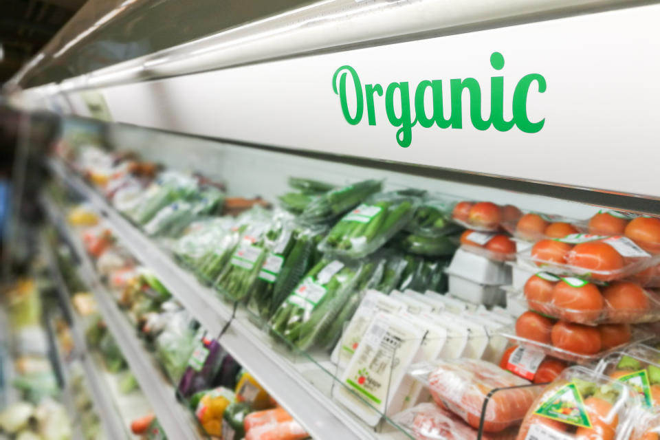 Organic food signage on modern supermarket fresh produce vegetable aisle to appeal to healthy lifestyle shoppers