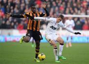 Hull City's Maynor Figueroa (L) challenges Manchester United's Adnan Januzaj during their English Premier League soccer match at the KC Stadium in Hull, northern England, December 26, 2013. REUTERS/Nigel Roddis