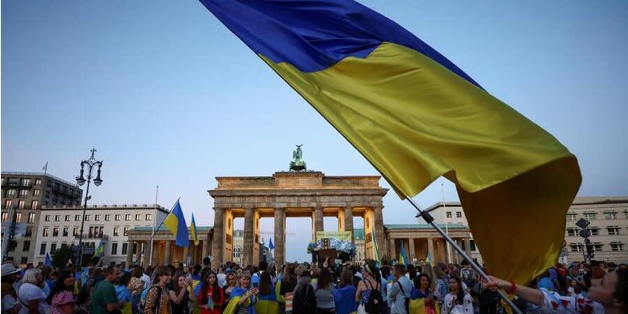 People near the Brandenburg Gate during the Freedom Parade on Ukraine's Independence Day in Berlin