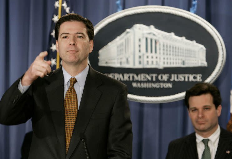 WASHINGTON - DECEMBER 15: Deputy U.S. Attorney General James B. Comey (L) speaks with assistant attorney general Christopher Wray (R) during a news conference at the Justice Department December 15, 2004 in Washington DC. Comey announced that America Online Inc. has entered into an agreement with the government to defer prosecution charges of aiding and abetting securities fraud in connection with transactions between AOL and PurchasePro.com.