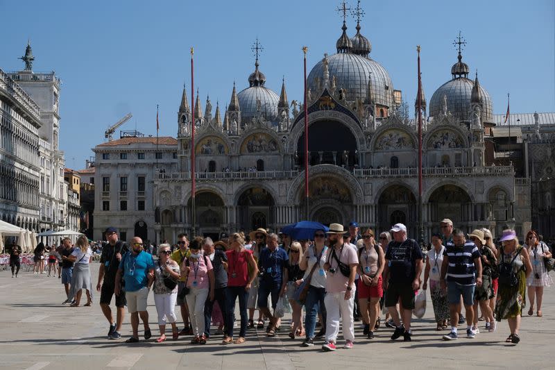 FILE PHOTO: Tourists visit Venice as the municipality prepares to charge them up to 10 Euro for entry into the lagoon city, in Venice