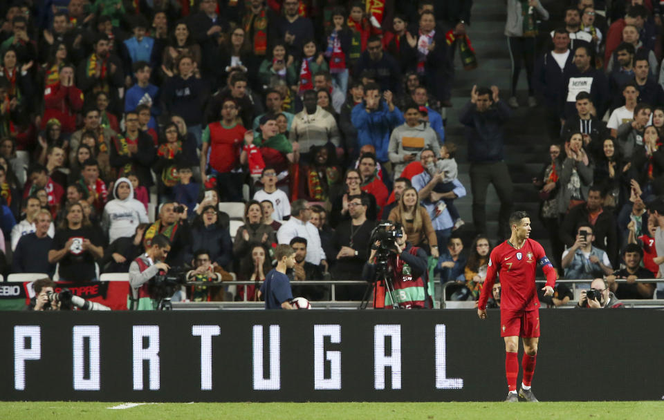 Portugal's Cristiano Ronaldo walks during the Euro 2020 group B qualifying soccer match between Portugal and Ukraine at the Luz stadium in Lisbon, Friday, March 22, 2019. (AP Photo/Armando Franca)