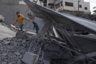 Palestinians inspect the site of a house that was demolished by the Israeli army in the West Bank village of Kafr Dan, near Jenin, Monday, Jan. 2, 2023. Palestinians Samer Houshiyeh and Fouad Abed were shot and killed during clashes with the Israeli army in the village of Kafr Dan near the northern city of Jenin. The Israeli military said it entered Kafr Dan late Sunday to demolish the houses of two Palestinian gunmen who killed an Israeli soldier during a firefight in September. The military said troops came under heavy fire and fired back at the shooters. (AP Photo/Nasser Nasser)