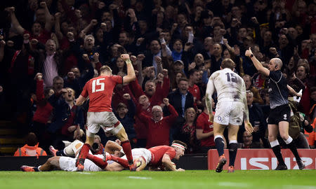 Rugby Union - Six Nations Championship - Wales v England - Principality Stadium, Cardiff, Britain - February 23, 2019 Wales' Liam Williams celebrates as Josh Adams scores their second try REUTERS/Rebecca Naden