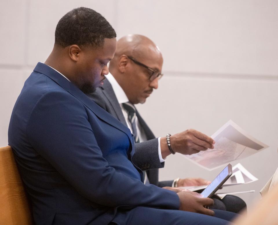 Charles Tyree Moore, III, and his defense attorney Craig Brown review documents before a stand-your-ground hearing before Circuit Judge John Simon on Thursday, March 2, 2023. Moore is accused of May 2022 killing Durrell Palmer. 