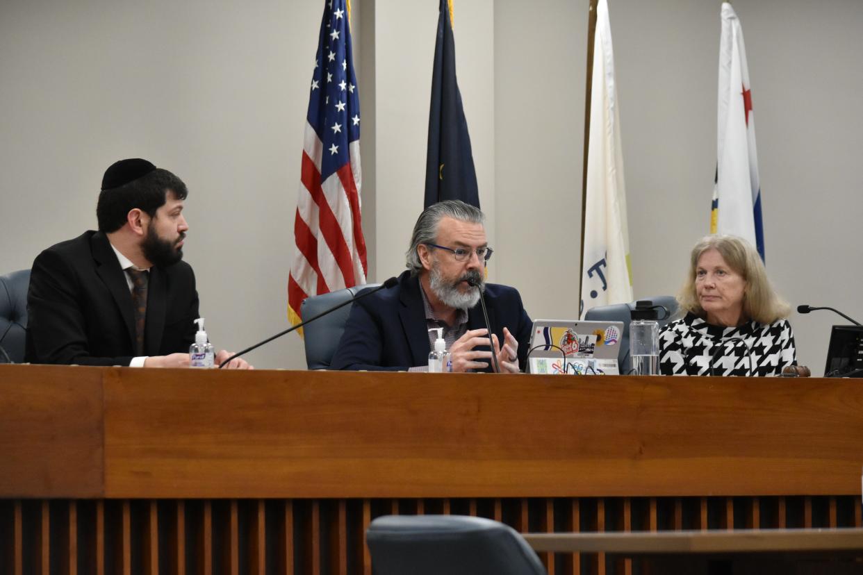 From left to right, South Bend Redevelopment Commission members Eli Wax, Troy Warner and Marcia Jones discuss a purchase of a five-acre parcel of land that could someday house a low-barrier homeless shelter on Thursday, Feb. 8, 2024.