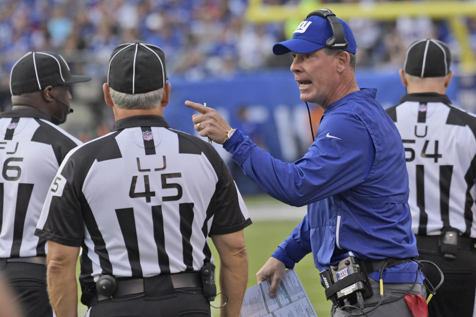 New York Giants head coach Pat Shurmur, right, talks with referees during the first half of an NFL football game against the New Orleans Saints, Sunday, Sept. 30, 2018, in East Rutherford, N.J. (AP Photo/Bill Kostroun)