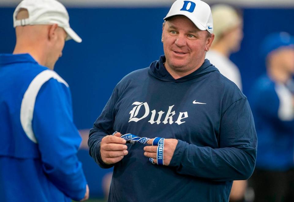 Duke head coach Mike Elko talks with offensive coordinator Kevin Johns during the Blue Devils’ spring practice on Friday, March 24, 2023 in Durham, N.C.