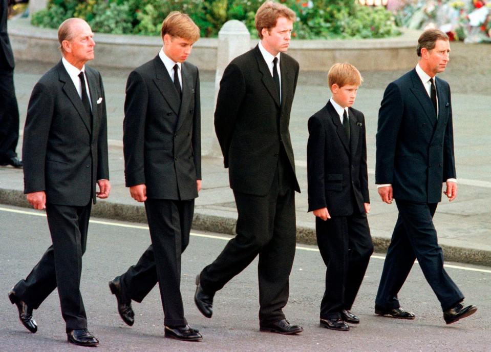 Prince Philip, Prince William, Charles Earl Spencer, Prince Harry and Prince Charles walk outside Westminster Abbey behind the coffin during the funeral procession for Princess Diana on Sept. 6, 1997.